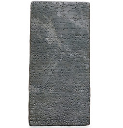 Stone slab inscribed with cuneiform text, commemorating the restoration of Assur's temple by king Adad-nerari I