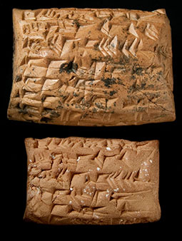 Photograph of inscribed clay tablet and the inscribed clay envelope that surrounded it