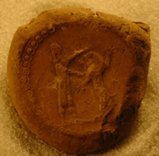Royal stamp seal showing the Assyrian king stabbing a rearing lion with his sword